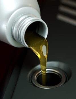 Pouring oil into an engine